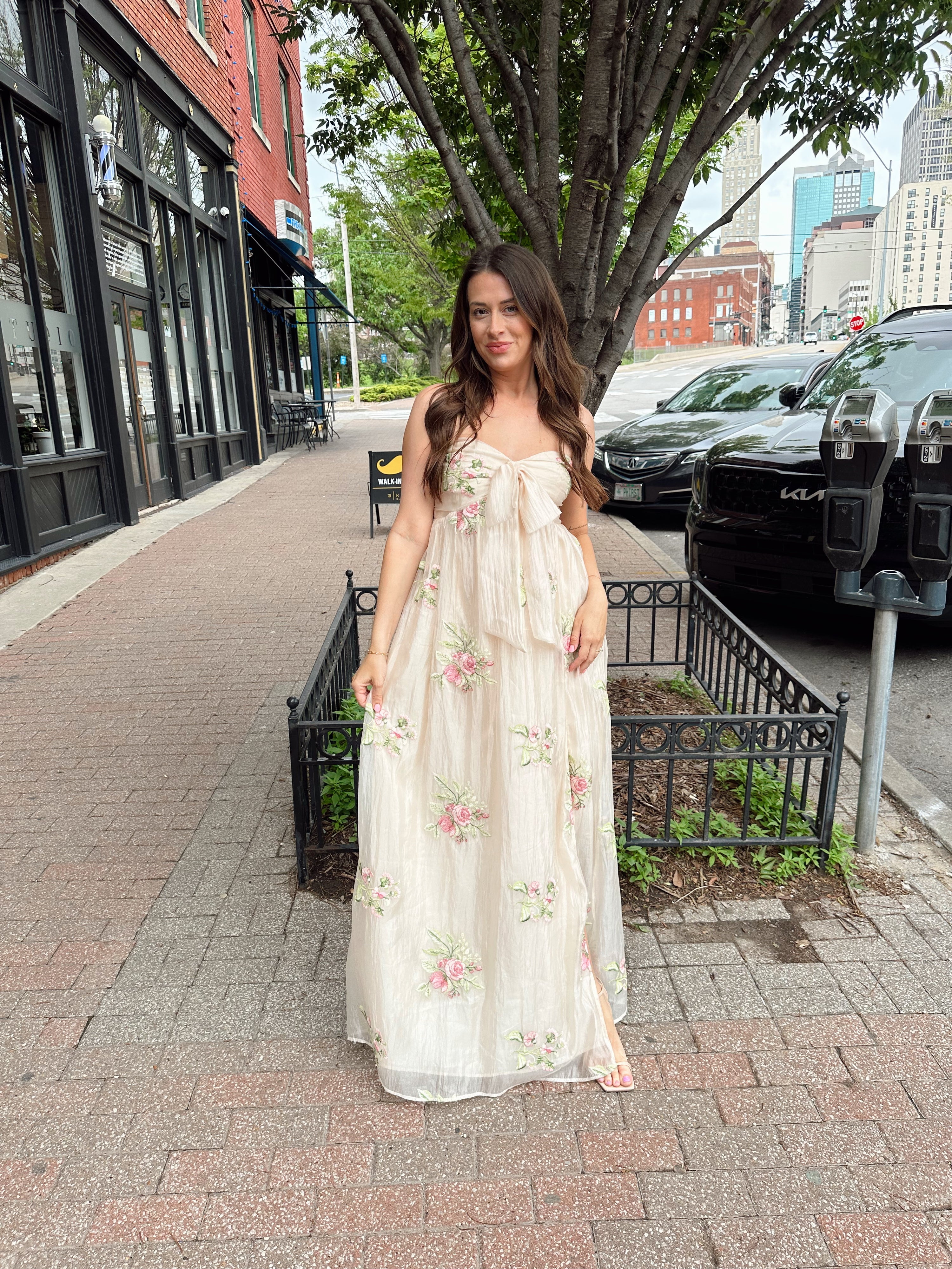 Strapless beige chiffon maxi dress with pink floral embroidery and leg slit