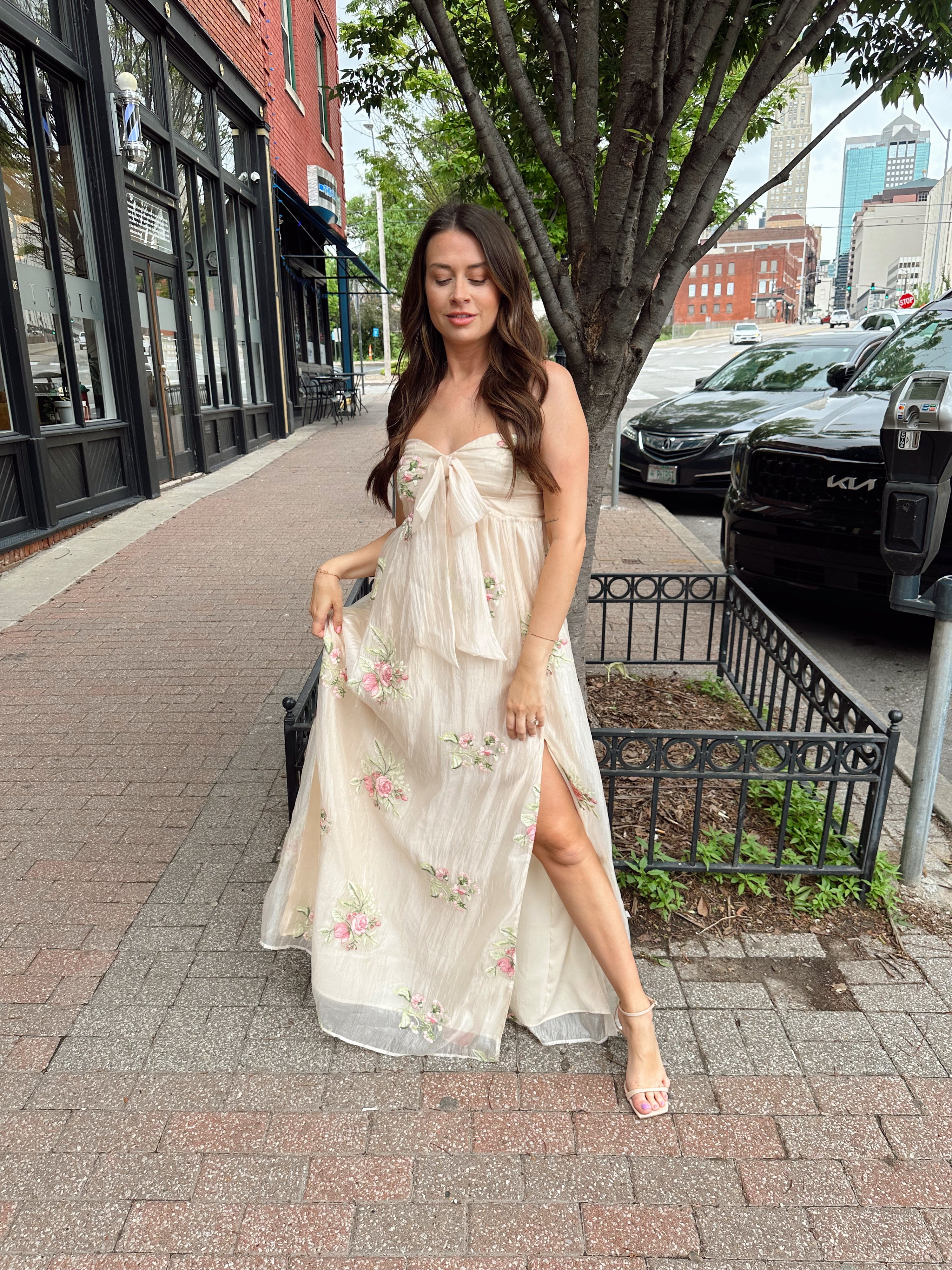Strapless beige chiffon maxi dress with pink floral embroidery and leg slit