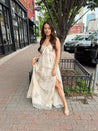 Strapless beige chiffon maxi dress with pink floral embroidery and leg slit