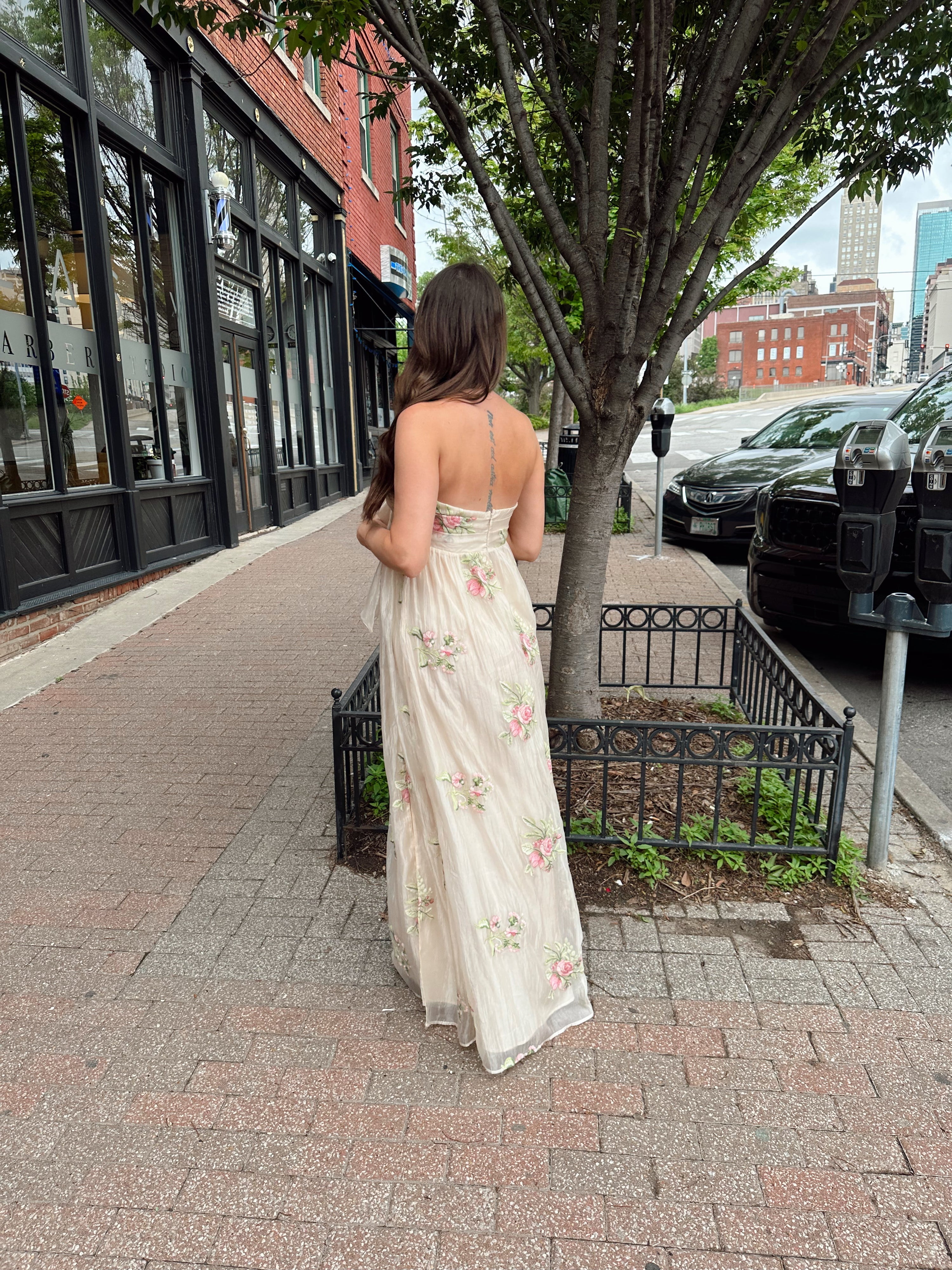 Strapless beige chiffon maxi dress with pink floral embroidery and leg slit