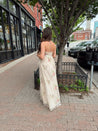 Strapless beige chiffon maxi dress with pink floral embroidery and leg slit