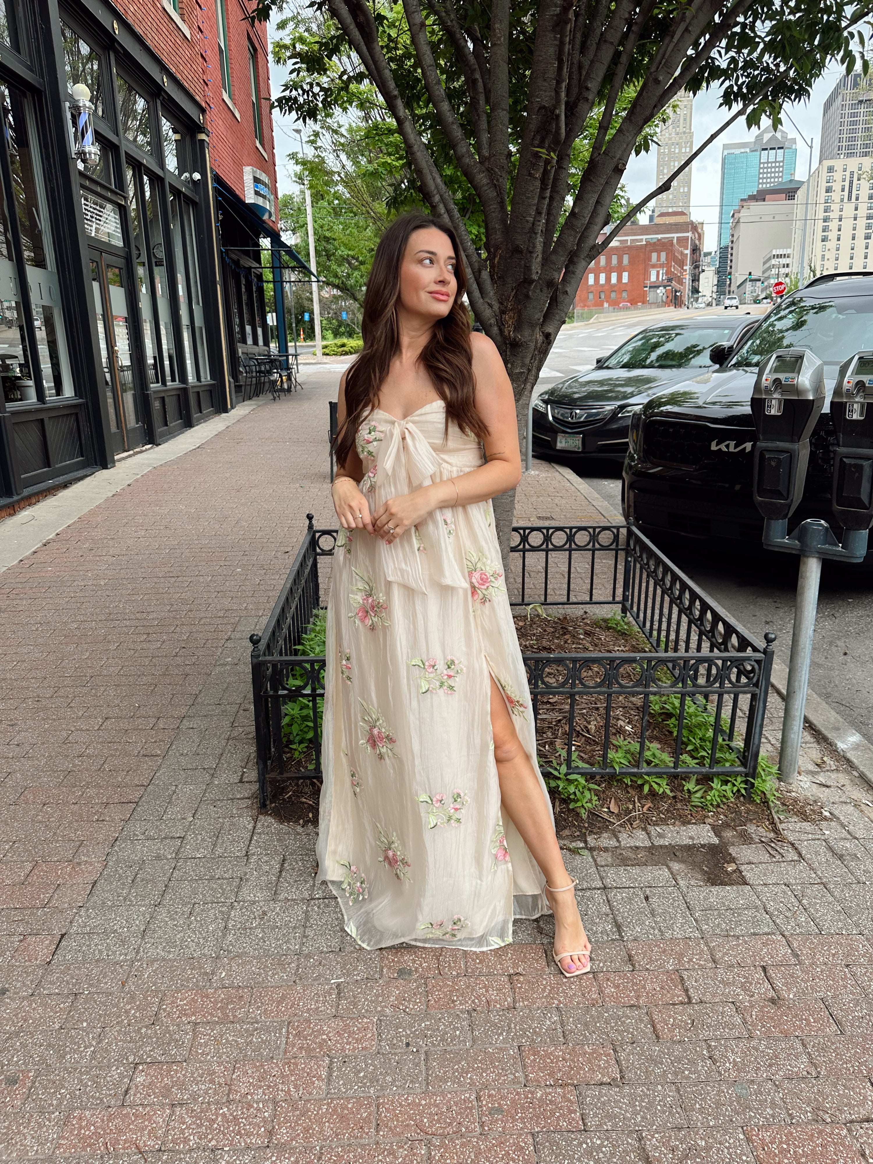 Strapless beige chiffon maxi dress with pink floral embroidery and leg slit