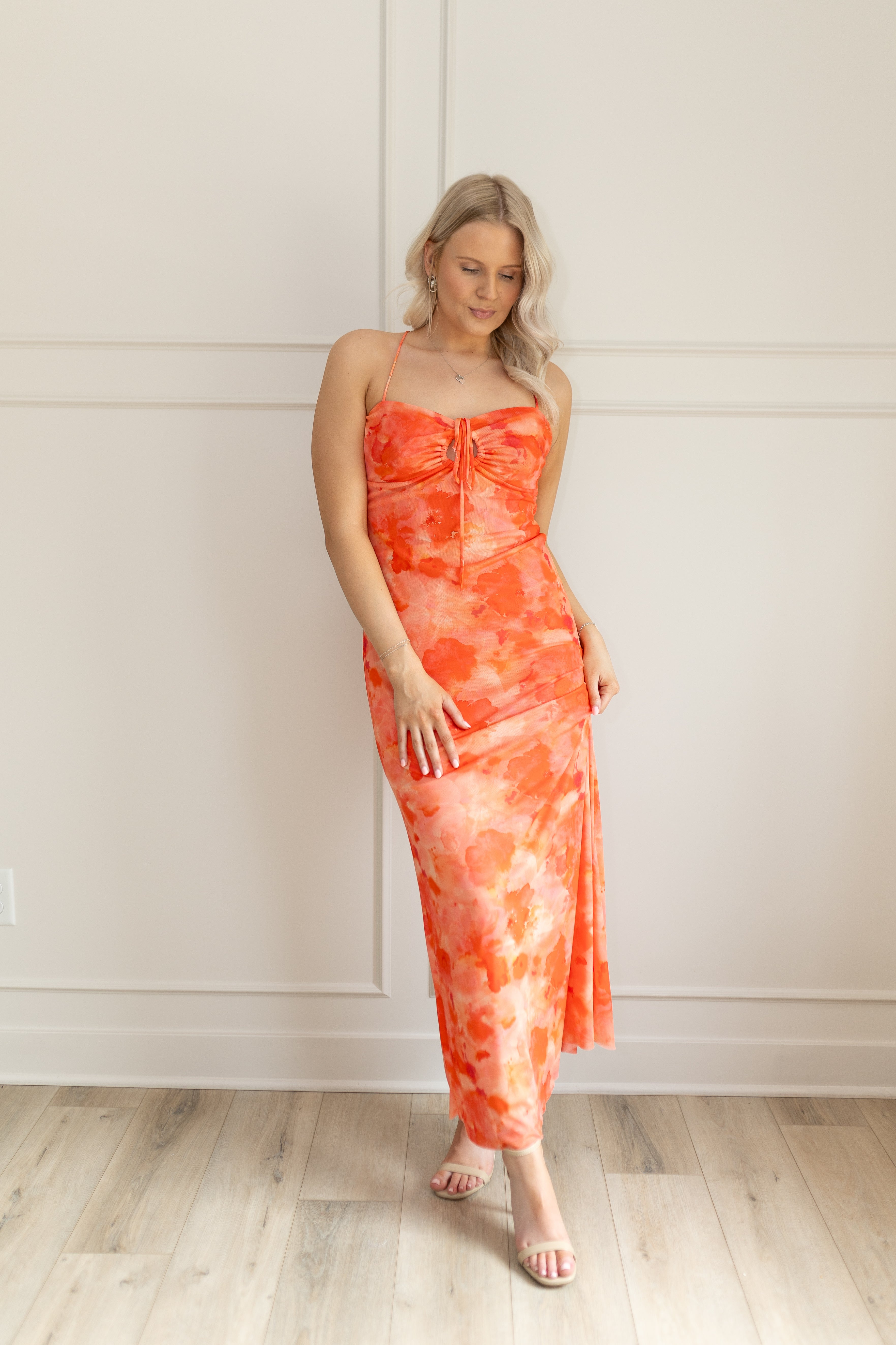 Orange mesh floral mini dress with adjustable spaghetti straps and keyhole cut out. 