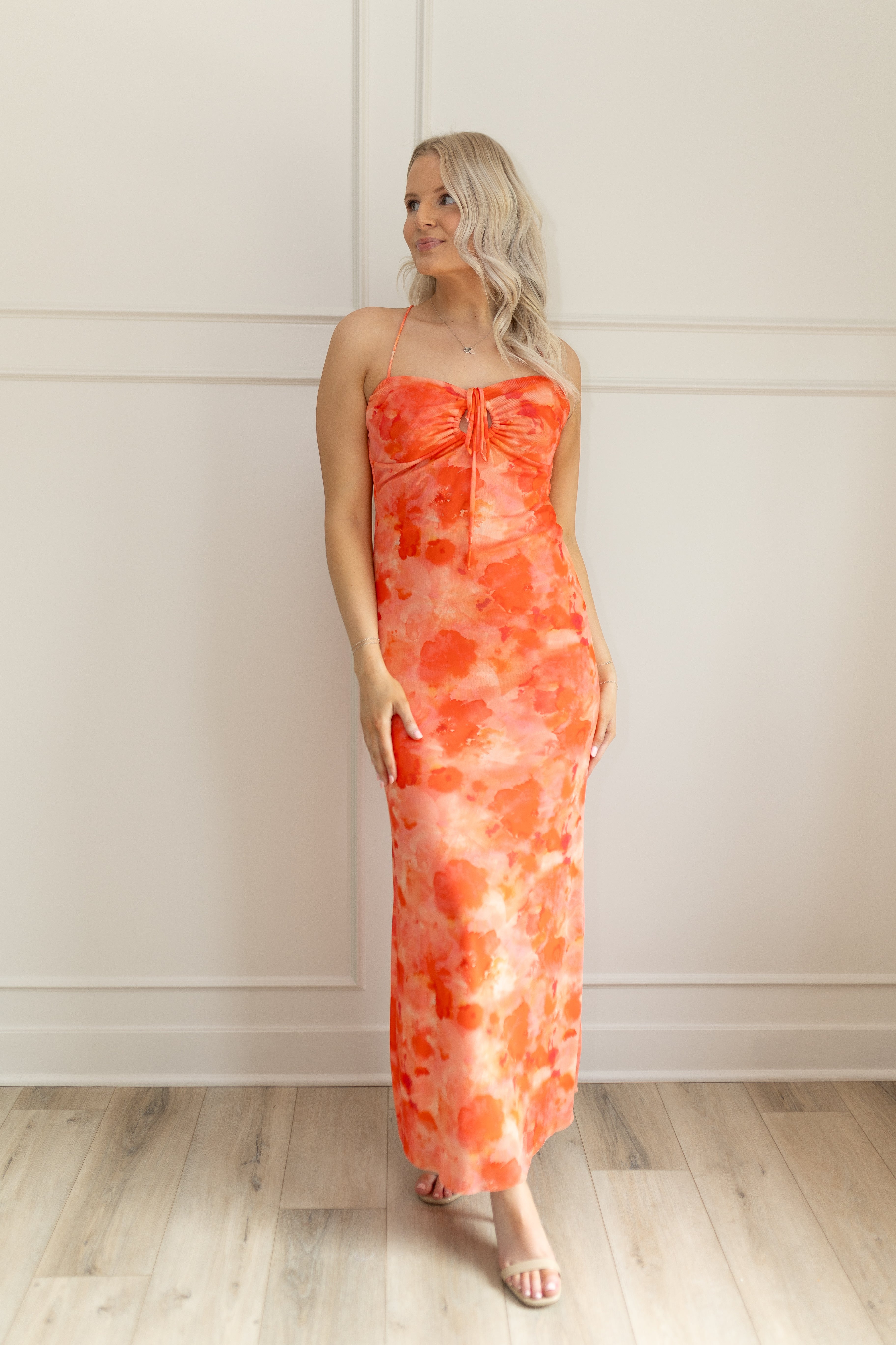 Orange mesh floral mini dress with adjustable spaghetti straps and keyhole cut out. 