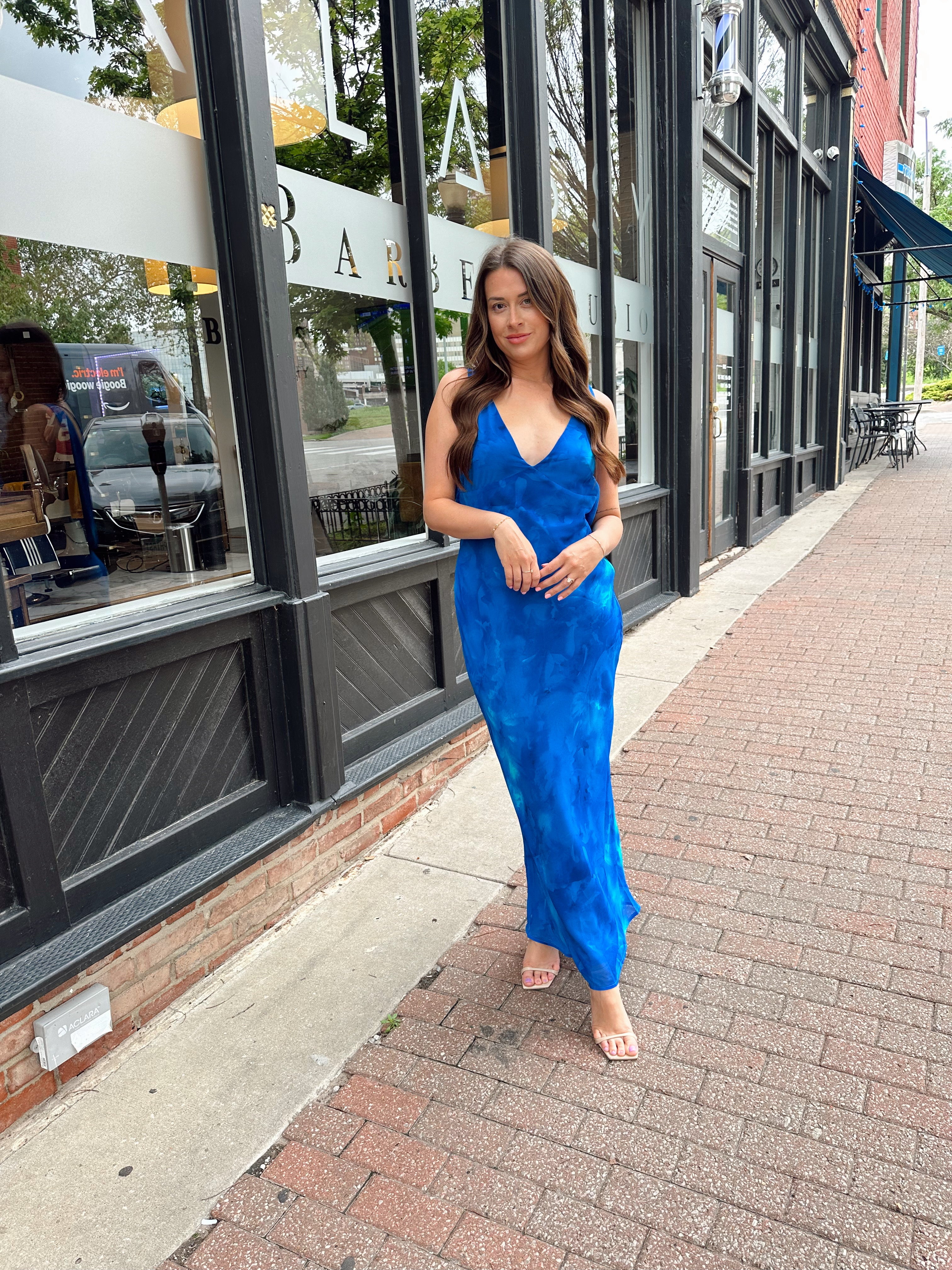Blue watercolor maxi dress with v neckline and cowl back. 