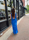 Blue watercolor maxi dress with v neckline and cowl back. 