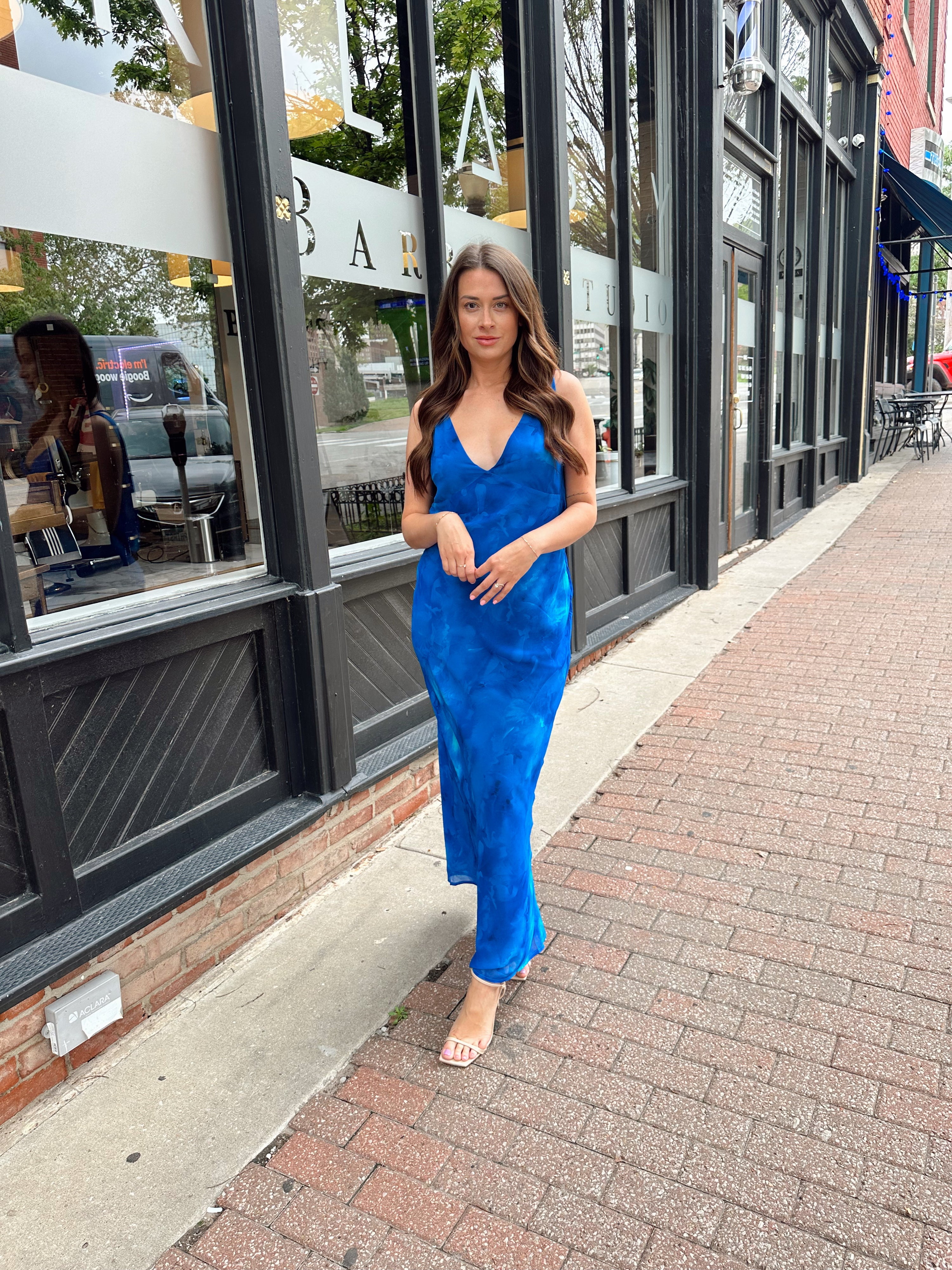Blue watercolor maxi dress with v neckline and cowl back. 
