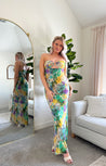 Purple and green tropical print maxi dress with cutout ring. 