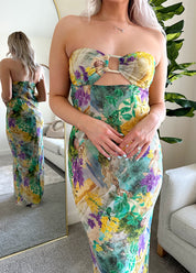 Purple and green tropical print maxi dress with cutout ring. 