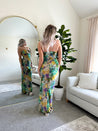 Purple and green tropical print maxi dress with cutout ring. 