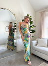 Purple and green tropical print maxi dress with cutout ring. 