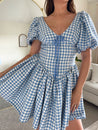Blue and white tweed gingham puff sleeve mini dress with drop waist and tie detail. 